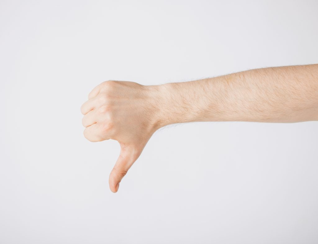 man showing thumbs down
