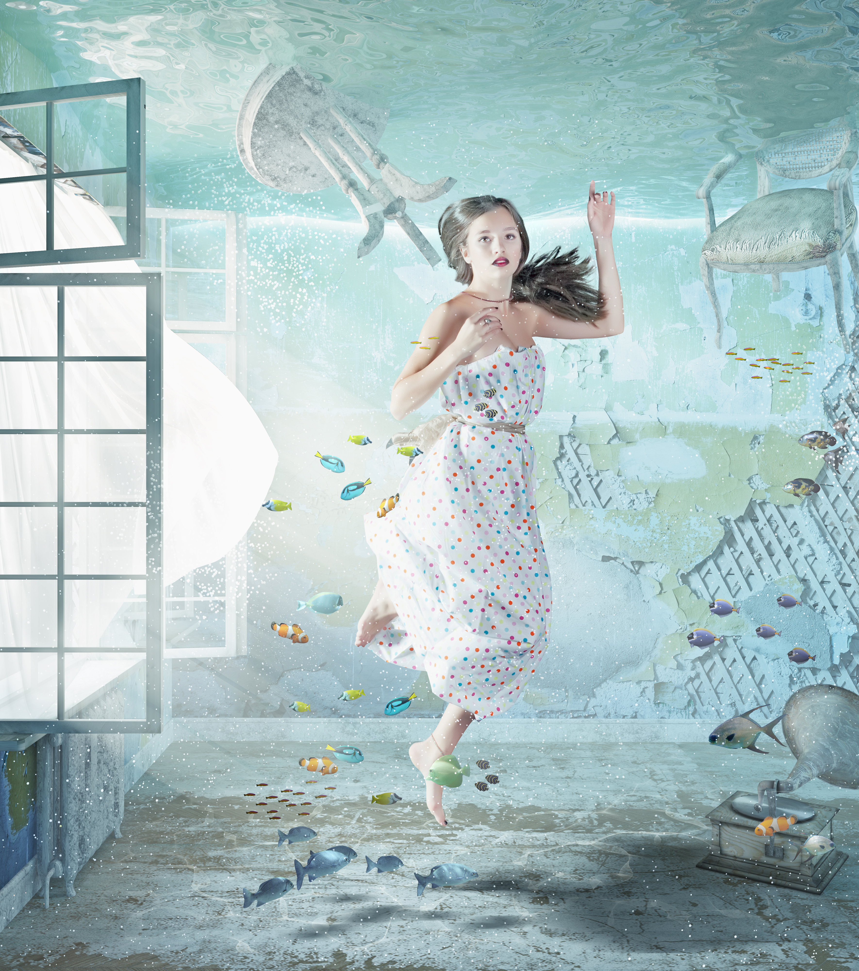 the young beautiful girl underwater in the flooded interior. creative concept